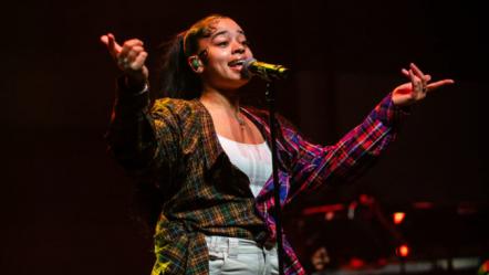 Ella Mai Throws Shade At Jacquees Over Trip