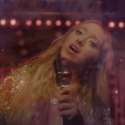 Emma Charles Captures The Magic Of A Pre-Pandemic Karaoke Night In "Osmosis" Video