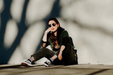 Queer Indie-Rock Artist America Jayne Details Her Identity Journey In New Single "My Boyfriend's Roommate's Girlfriend"